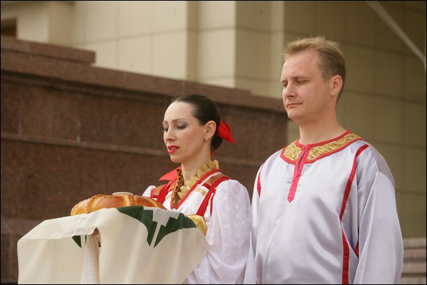 Hosts are welcoming guests with bread and salt