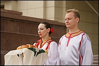 Hosts are welcoming guests with bread and salt